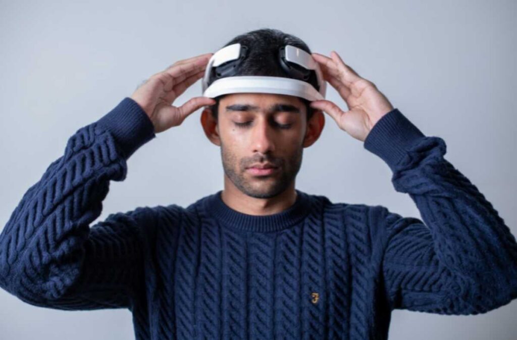 The Treatment That’s Quietly Rewiring How the World Treats Depression, Anxiety & Other Disorders 1 Doctor fitting a patient with the portable EASE 2.0 neuromodulation headset for depression treatment
